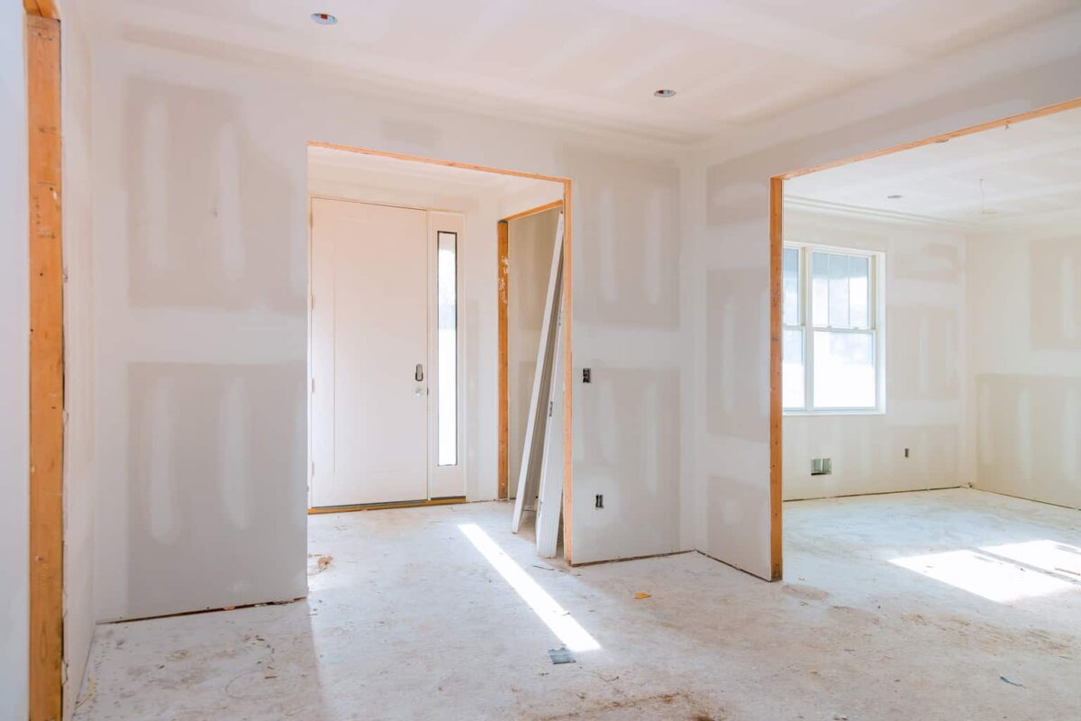 Should Sheetrock Touch the Floor?